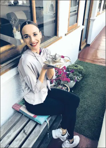  ?? PICTURE: ALLISON FOAT ?? Cape Town City Ballet’s lead ballerina Laura Bösenberg with a a silver mustard pot that dates back to 1899. The pot was given to Bösenberg by an aunt.