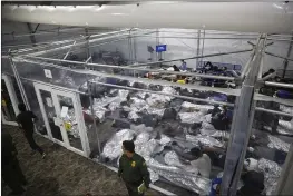  ?? DARIO LOPEZ-MILLS — THE ASSOCIATED PRESS FILE ?? Young migrant children lie inside a pod at the Donna Department of Homeland Security holding facility in Donna, Texas.