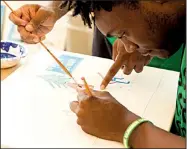  ?? Special to the Democrat-Gazette ?? Tiyun Nealy works on an art project at Arkansas Promise, a research project that provides education, employment training and support services for 2,000 Arkansas teenagers with disabiliti­es to help them develop job skills.