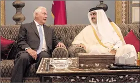  ?? AP/ALEXANDER W. RIEDEL ?? U.S. Secretary of State Rex Tillerson meets Tuesday with Sheikh Tamim Bin Hamad Al Thani, Qatar’s emir, at the Sea Palace in Doha.