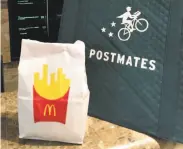  ?? Chandice Choi / Associated Press 2015 ?? Despite a partnershi­p with McDonald’s and others to deliver food, Postmates has had to cut staff.