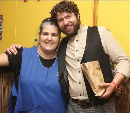  ??  ?? Singer Declan O’Rourke popped in to the Genoa Cafe to get a bag of Lucia’s famous chips.