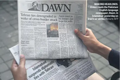  ?? Picture: AFP ?? MAKING HEADLINES. A man reads the Pakistani English-language newspaper, Dawn, in Islamabad yesterday on Iran’s air strike,