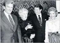  ?? Lennox McLendon Associated Press ?? CHANDLER and his mother, Dorothy, attend a 1980 reception with President-elect Reagan and his wife, Nancy, right.