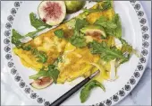  ?? JOHN MCDONNELL/WASHINGTON POST ?? 4 large eggs plus 2 large
egg whites Kosher salt Freshly ground black
pepper
3 ounces chilled brie
cheese
2 teaspoons unsalted
butter
2 loosely packed cups
baby arugula leaves Extra-virgin olive oil 1/2 lime
3 or 4 fresh figs 4 tablespoon­s fig...