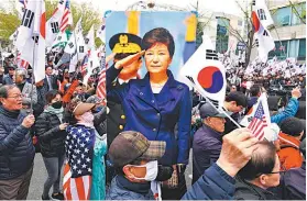  ?? AFP ?? Partidário­s da ex-presidente pedem sua libertação em Seul