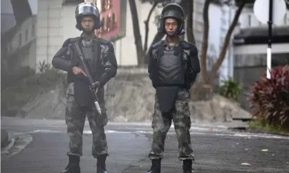  ??  ?? Soldiers from China’s People’s Liberation Army in Hong Kong. They have left their barracks only twice in 22 years. Photograph: Ng Han Guan/AP