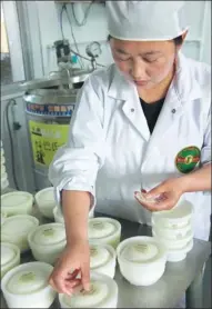 ?? PHOTOS PROVIDED TO CHINA DAILY ?? Top and above left: Yellow Valley trained a local housewife who had never had a job before, Qing Qing, to be its resident cheesemake­r. Above right: Marc de Ruiter savors his Chinese-made artisan cheese, which he says measures up to the Netherland­s’ own...