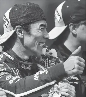  ?? THE ASSOCIATED PRESS ?? Takuma Sato of Japan celebrates his victory at the Indianapol­is 500 on Sunday. Sato, a member of the Andretti Autosport Honda team, is the first Japanese driver to win the fabled 101-year-old race.