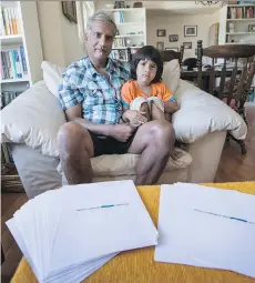  ?? DARREN STONE/TIMES COLONIST ?? Manjett Manhas and his four-year-old son Max with medical records that were sent to a stranger in Nanaimo by the non-profit MedRecords Distributi­on Associatio­n.