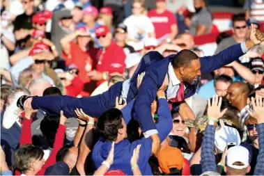  ?? AP PHOTO/JOHN BAZEMORE ?? Georgia state Rep. Vernon Jones crowd surfs during a campaign rally for President Donald Trump at Middle Georgia Regional Airport, in Macon, Ga., last October. Jones announced this week his plan to run against Gov. Brian Kemp in a primary.