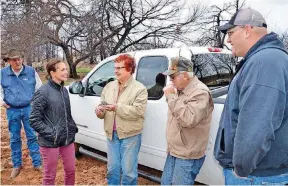  ?? [PHOTOS PROVIDED] ?? LEFT: Doug Fitch, of the Grant County Conservati­on District, Christina Rehkop of Devon, Ilajoy and Roy Dale Covalt, and Ethan Nall of Devon are shown as Devon presented a pickup on Wednesday near Woodward to the Covalts who were impacted by the...