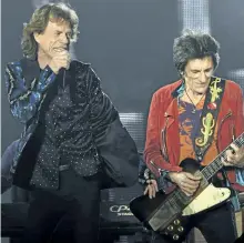  ?? THE ASSOCIATED PRESS FILES ?? Above: Mick Jagger and guitarist Ron Wood perform on stage at the Esprit Arena in Duesseldor­f, Germany. The Rolling Stones released an album of 32 songs recorded between 1963-65 last week.