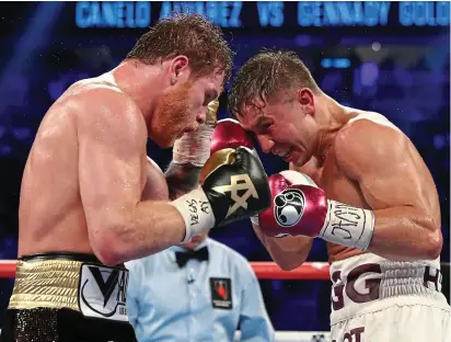  ?? GETTY IMAGES ?? Close encounters: Canelo (left) and Golovkin in their second fight, which the Mexican won