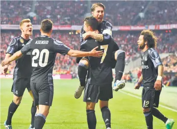  ?? — AFP photo ?? (From left) Real Madrid’s players Toni Kroos, Marco Asensio, Sergio Ramos, Cristiano Ronaldo and Marcelo celebrate after the second goal during the UEFA Champions League quarter-final first leg match against Bayern Munich in Munich, southen Germany.