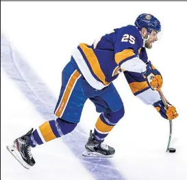  ?? ELSA / Getty Images ?? Defenseman Devon Toews, pictured with the Islanders during the Stanley Cup playoffs in August, has signed a four-yeal deal with the Avalanche.