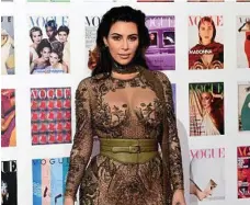  ?? PHOTO: IAN WEST/PA ?? Kim Kardashian is an expert at wearing underwear as outerwear. Here she poses for photograph­ers as she arrives for The Vogue 100 Gala Dinner, in London, last year.