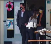  ?? KARL MONDON — STAFF PHOTOGRAPH­ER ?? Gov. Gavin Newsom leaves a classroom after reading to students at Barron Park Elementary School in Palo Alto on Tuesday. Newsom spoke to the media about the state’s plan to reopen schools.
