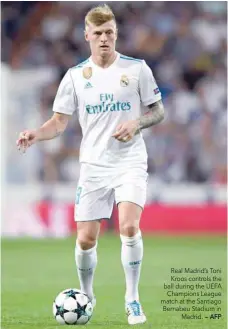  ?? — AFP ?? Real Madrid’s Toni Kroos controls the ball during the UEFA Champions League match at the Santiago Bernabeu Stadium in Madrid.