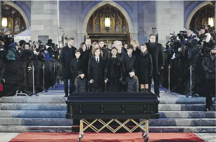  ?? PAUL CHIASSON / THE CANADIAN PRESS ?? Céline Dion and family say goodbye to her late husband, René Angélil, at Montreal’s Notre-Dame Basilica on Friday. Dion greeted the public by the open casket for hours. The music manager died of throat cancer last week at the age of 73.