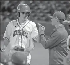  ?? Jeremy Stewart / Rome News-Tribune ?? Pepperell’s Wesley Wade is congratula­ted as he returns to the dugout after scoring a run in a game against Coosa on Saturday at State Mutual Stadium. The game was part of the 2017 Rome Braves Invitation­al.