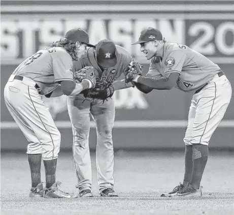  ?? Karen Warren / Houston Chronicle ?? Colby Rasmus, left, having bonded with teammates like Jake Marisnick, center, and George Springer, felt compelled to return to the Astros instead of testing the free-agent waters in the offseason.