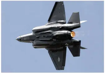  ?? TY GREENLEES / STAFF 2017 ?? A Lockheed Martin F-35A Lightning II flies at Vectren Dayton Air Show. The F-35 has nearly 1,000 reported deficienci­es; nearly 200 would not be fixed before full-rate production, the GAO says.