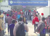  ?? HT PHOTO ?? Candidates waiting outside the skill developmen­t centre in Amritsar on Sunday.