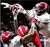  ?? AP/JOHN AMOS ?? Alabama defensive backs Jared Mayden (21) and Saivion Smith (4) stop Georgia wide receiver Riley Ridley (8) from catching a pass during the second half of the SEC Championsh­ip Game on Saturday in Atlanta. Alabama remained the top team in the final College Football Playoff rankings released Sunday.