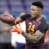  ?? AP/DARRON CUMMINGS ?? Former Ole Miss star receiver D.K. Metcalf made a big impression last week at the NFL scouting combine in Indianapol­is, clocking in a 4.33 in the 40-yard dash.