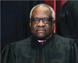  ?? ERIN SCHAFF THE NEW YORK TIMES VIA AP, POOL ?? Associate
Justice Clarence Thomas sits during a group photo at the Supreme Court in Washington, in April 2021. Many conservati­ves, including
Justice Clarence Thomas, have expressed concern about the unchecked, unconstitu­tional power exercised by the Administra­tive State.