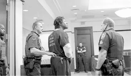  ?? JACOB LANGSTON/STAFF PHOTOGRAPH­ER ?? Markeith Loyd is escorted into court at the Orange County Courthouse on Tuesday, where he withdrew his motion for a new attorney.