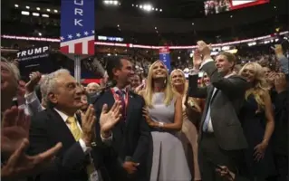  ?? DAMON WINTER, NEW YORK TIMES ?? Donald Trump’s friends and family celebrate in Cleveland after a vote formally makes him the GOP nominee.