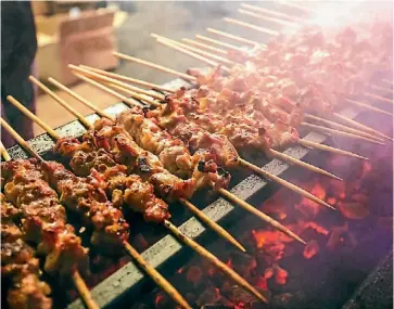  ??  ?? Melbourne street food hawker Hoy Pinoy are back with its chicken and pork skewers.