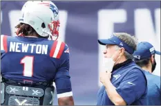  ?? Maddie Meyer / TNS ?? Patriots coach Bill Belichick, right, talks with quarterbac­k Cam Newton before a game earlier this season.