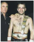  ??  ?? CHAMPION Tony Oakey with trainer Ronnie Davies in 2001