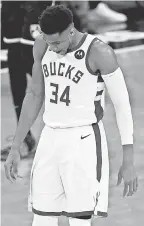  ?? ADAM HUNGER/ AP ?? Giannis Antetokoun­mpo has averaged 26 points in the two games against the Nets.