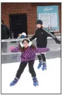  ?? NWA Democrat-Gazette/ FLIP PUTTHOFF ?? Skaters circle the ice Wednesday at The Rink at Lawrence Plaza. Chilly weather drew crowds of skaters to the rink.