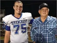  ?? (Submitted photo) ?? University of Arkansas offensive line commitment Cole Carson (left), 6-6, 285 pounds, of Bogata (Texas) Rivercrest, spends his time off the field with his grandfathe­r Sonny Belcher working on a ranch they co-own.