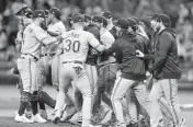  ?? NATHAN RAY SEEBECK USA TODAY NETWORK ?? The Texas Rangers celebrate after defeating Tampa Bay in Game 2 of the wild-card series Wednesday afternoon.