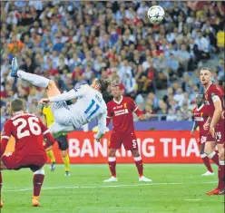  ?? REUTERS ?? ▪ Real Madrid's Gareth Bale scores their second goal with an overhead kick against Liverpool in the Champions League final in Kiev on Saturday.