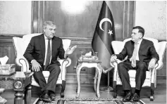  ?? — AFP photo ?? Tajani (left) meets with Libya’s unity government Prime Minister Fayez al-Sarraj at his office in the capital Tripoli.