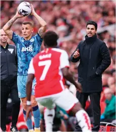  ?? — AFP photo ?? Arteta (right) gestures as Aston Villa’s defender Lucas Digne (left) prepares to take a throw-in during the English Premier League match at the Emirates Stadium in London.