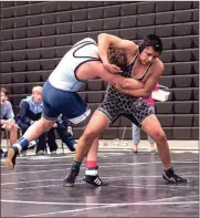  ?? TIM GODBEE / For the Calhoun Times ?? Calhoun’s Armando Monroy (right) goes for a sweep of a Lovett wrestler on Saturday at Area 3-AAA Duals.