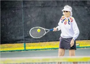  ?? PHOTOS BY JACOB LANGSTON/STAFF PHOTOGRAPH­ER ?? Senior Ladies Round Robin player Jean Carolan, the group’s oldest player at 95, plays a match Thursday morning at the Winter Park Tennis Center. The group for women 70 and older meets twice a week.