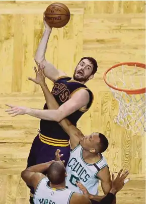  ?? AP PIC ?? Cavaliers’ Kevin Love (top) shoots over Celtics’ Avery Bradley (right) and Al Horford in Game 5 of the NBA Eastern Conference finals in Boston on Thursday.