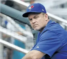  ?? JOHN BAZEMORE/THE ASSOCIATED PRESS ?? Toronto Blue Jays manager John Gibbons sits in the dugout before a game against the Atlanta Braves on May 18, in Atlanta. Gibbons could have been drafted by the Jays in 1980, if he made a better first impression.