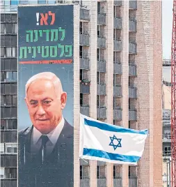  ?? AHMAD GHARABLI AFP VIA GETTY IMAGES ?? Posters by the Yesha Council, an umbrella organizati­on of municipal councils of Jewish settlement­s in the West Bank, reads: “No to a Palestinia­n state; sovereignt­y, do it right!”