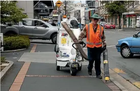  ?? PHOTO: HAMISH MCNEILLY/STUFF ?? Daryl has been cleaning the streets of Dunedin for 16 years, a job he described as being a ‘‘10-inone’’ type gig.