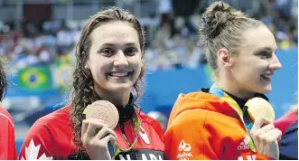  ?? JEAN LEVAC ?? Hungarian swimmer Katinka Hosszu, right, seen on the podium with Canadian Kylie Masse at the Rio Olympics, is spearheadi­ng an effort to form a profession­al swimmers’ union to garner strength in their dealings with the sport’s troubled internatio­nal...